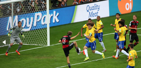Brazil becomes prime meat for the Germans, who defeated them 7-1. The ad inthe back is er... unfortunate. 